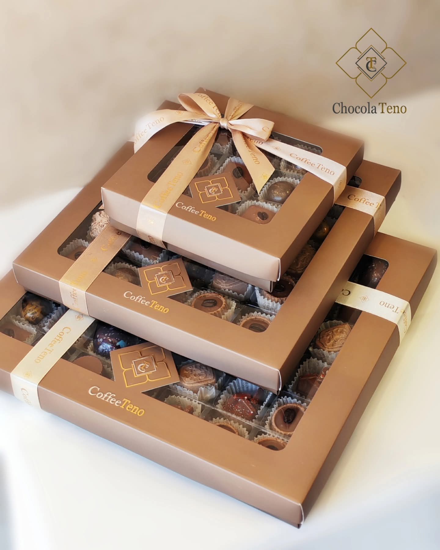 Three sizes of Coffee Teno gift boxes stacked